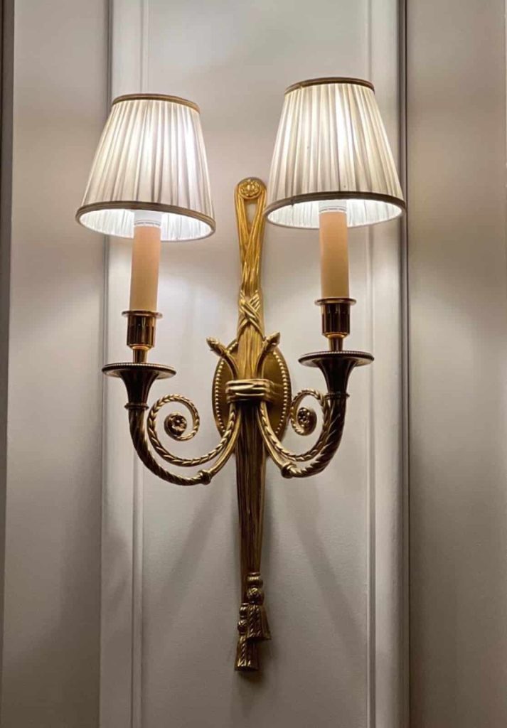 A luxury wall lighting sconce on a luxury wall - international cultural fluency