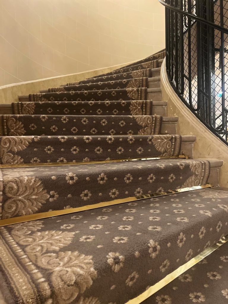 An opulent staircase rising - professionalism when dealing with escort services