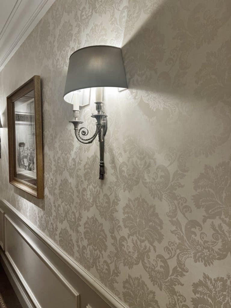 An opulent sconce on a luxury wall | What distinguishes elite escort agencies